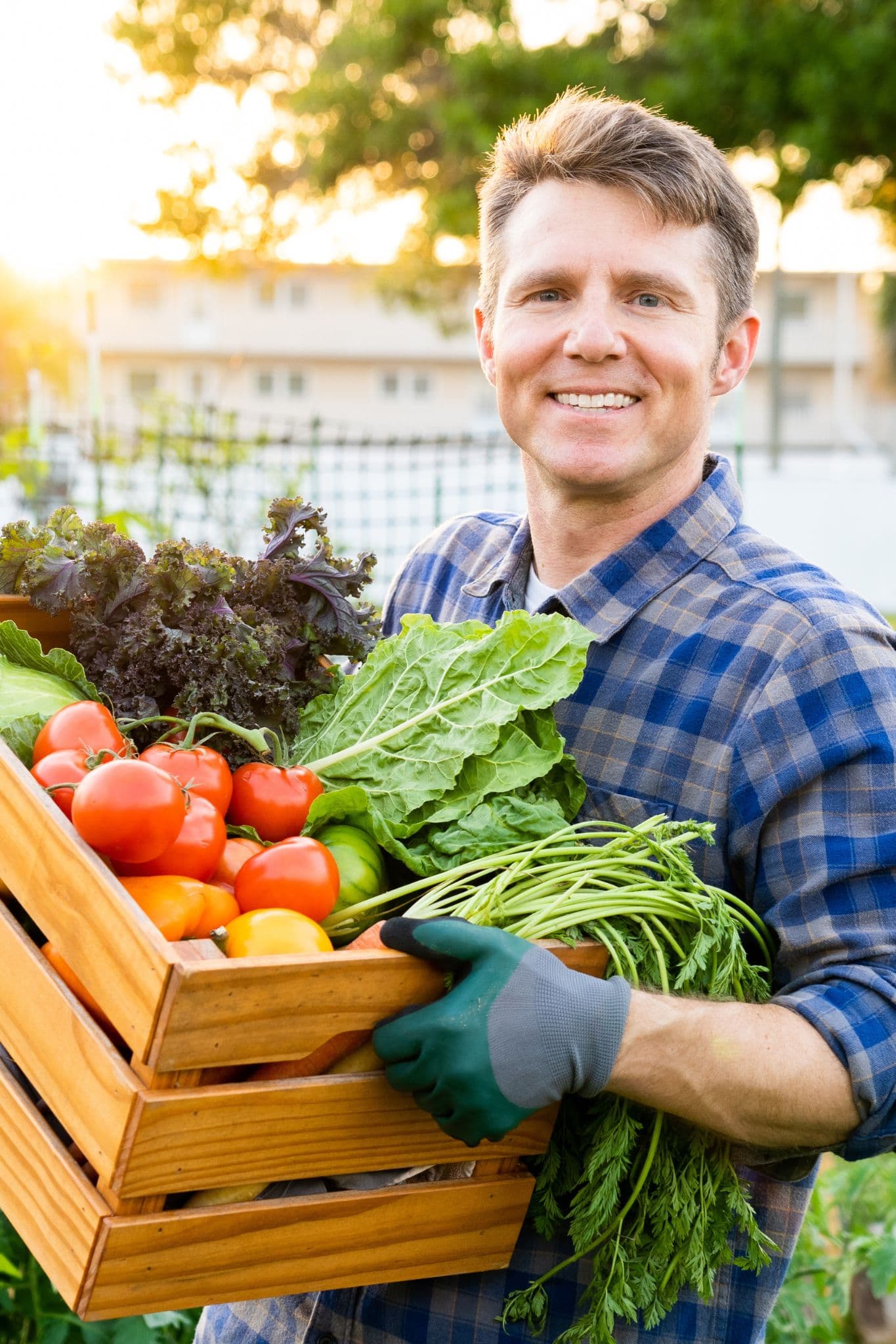 Dr. Scott Harrington with a harvest box in the garden